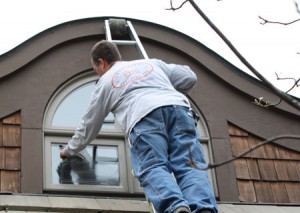 Washing the windows of a Kansas City home